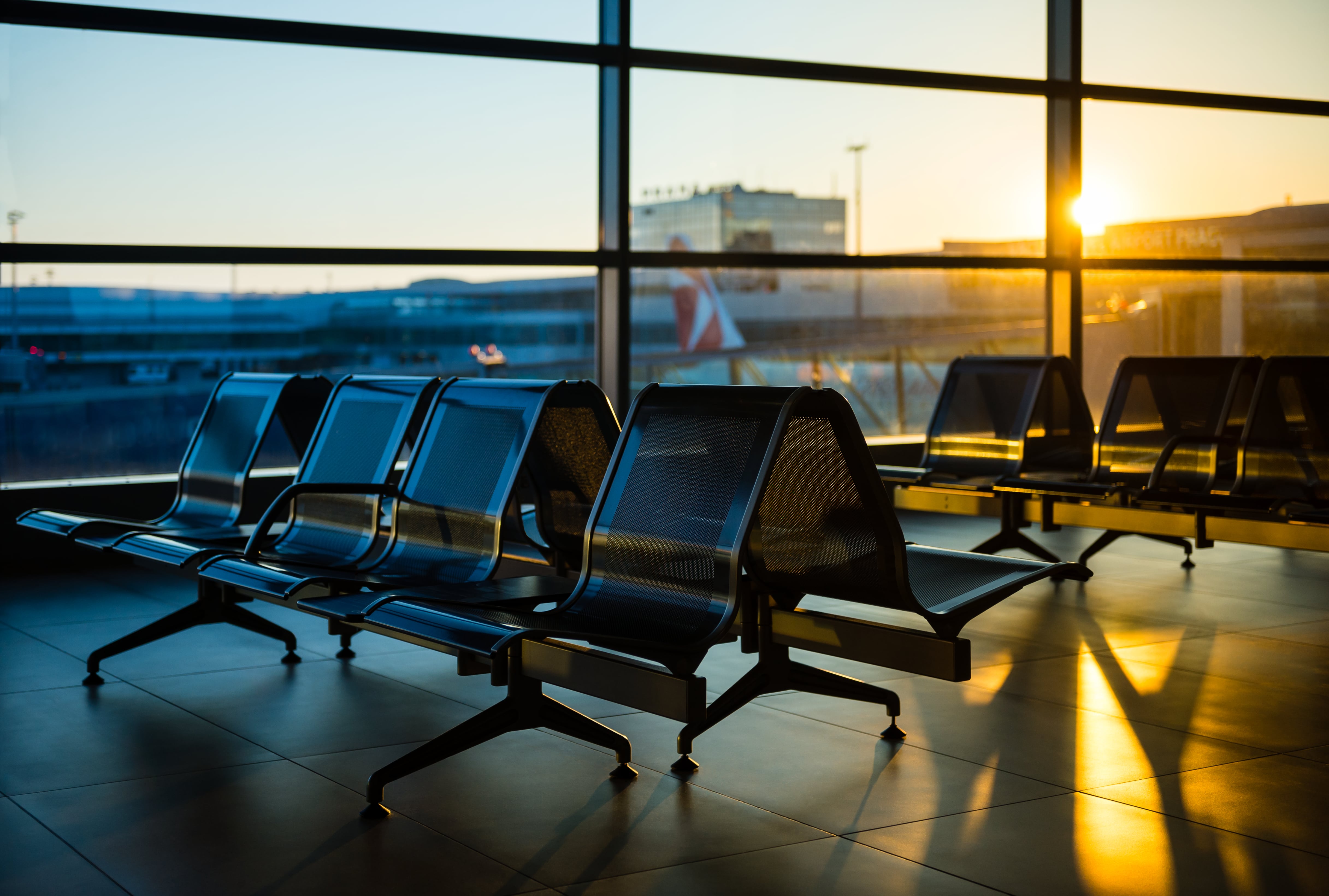 Empty seats at a boarding gate in an airport 