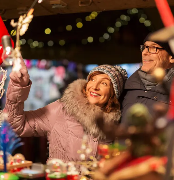 Couple browsing at a Christmas market
