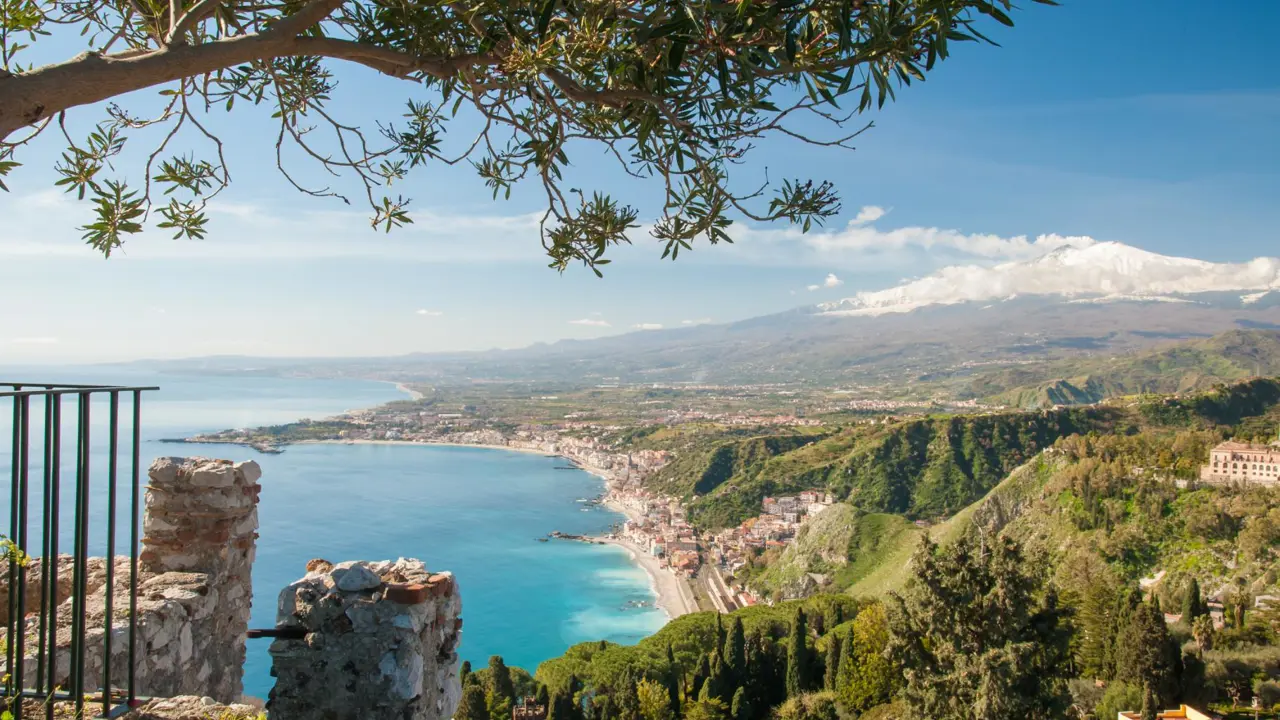 View of Giardini Naxos ond Mount Etna from Taormina, Sicily, Italy