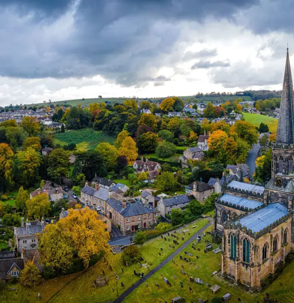 Bird's eye view of the town of Bakewell in the Peak District, showing the church, open fields and houses