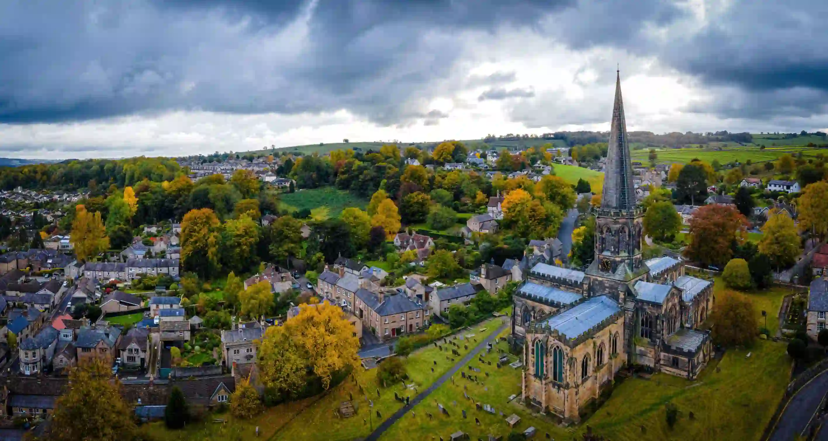 Bird's eye view of the town of Bakewell in the Peak District, showing the church, open fields and houses