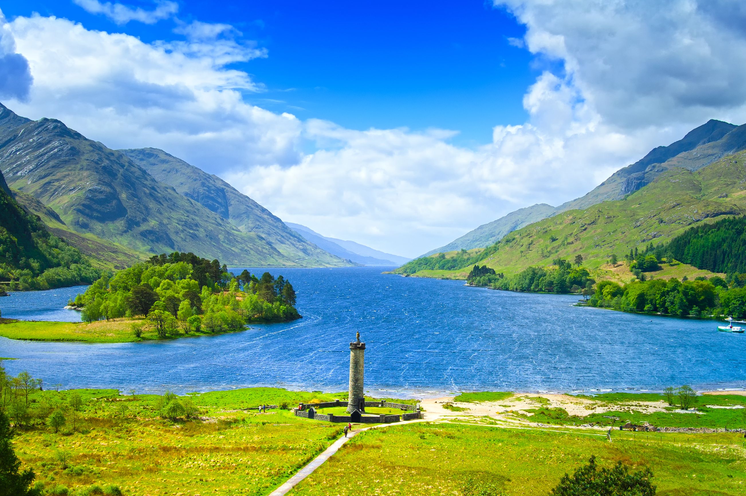 Zoomed out view of Glenfinnan Monument, Loch Shiel and surrounding mountains Scotland