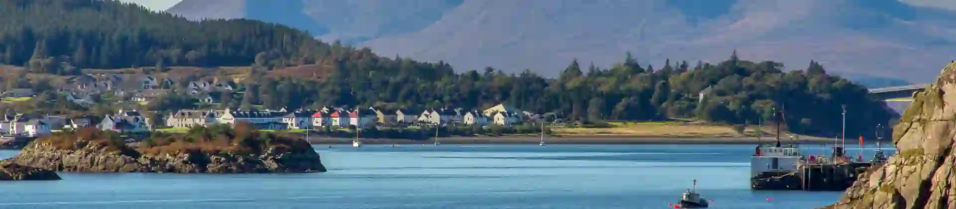View of the Kyle of Lochalsh with Scottish Highland mountains behind it