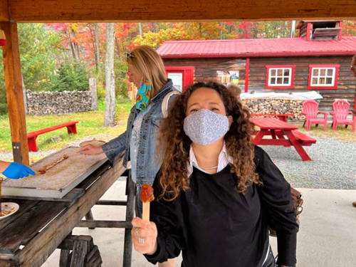 Kathy enjoys some authentic Canadian maple snacks at The Sugar Shack.