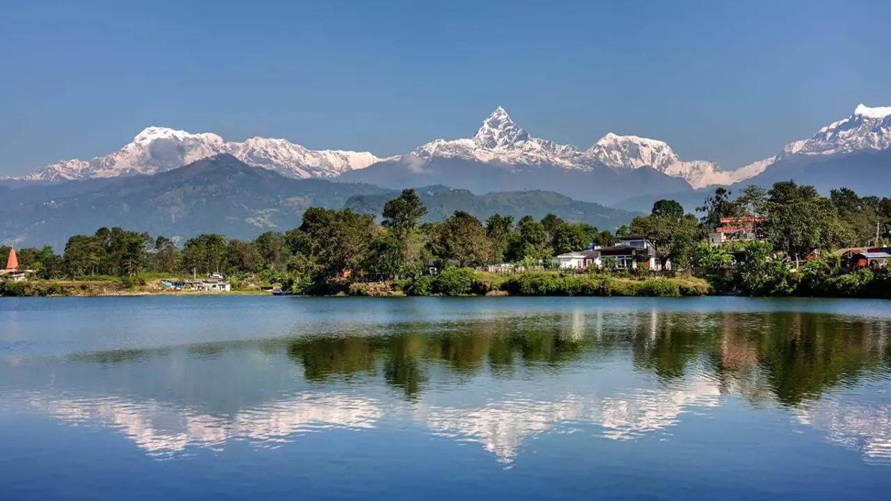 View At Annapurna Mountain Range And Its Reflection In Phewa Lake In Pokhara Nepal