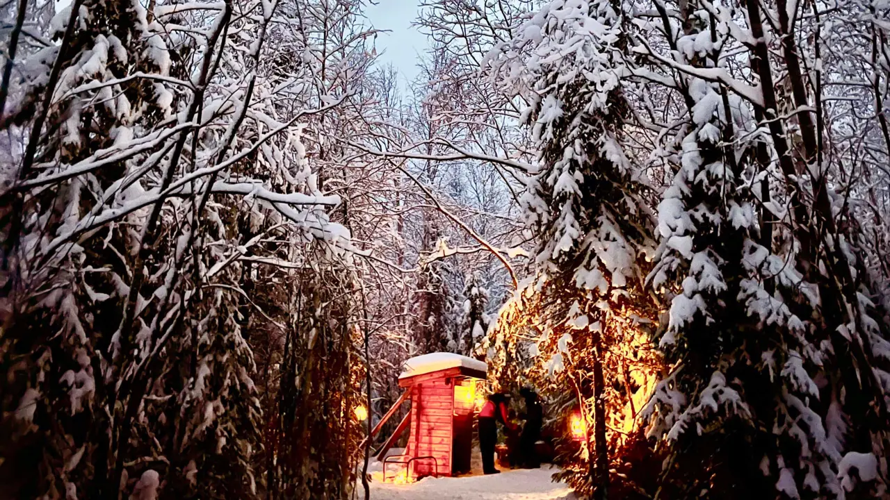 Small cabin in the snowy woods in Lapland