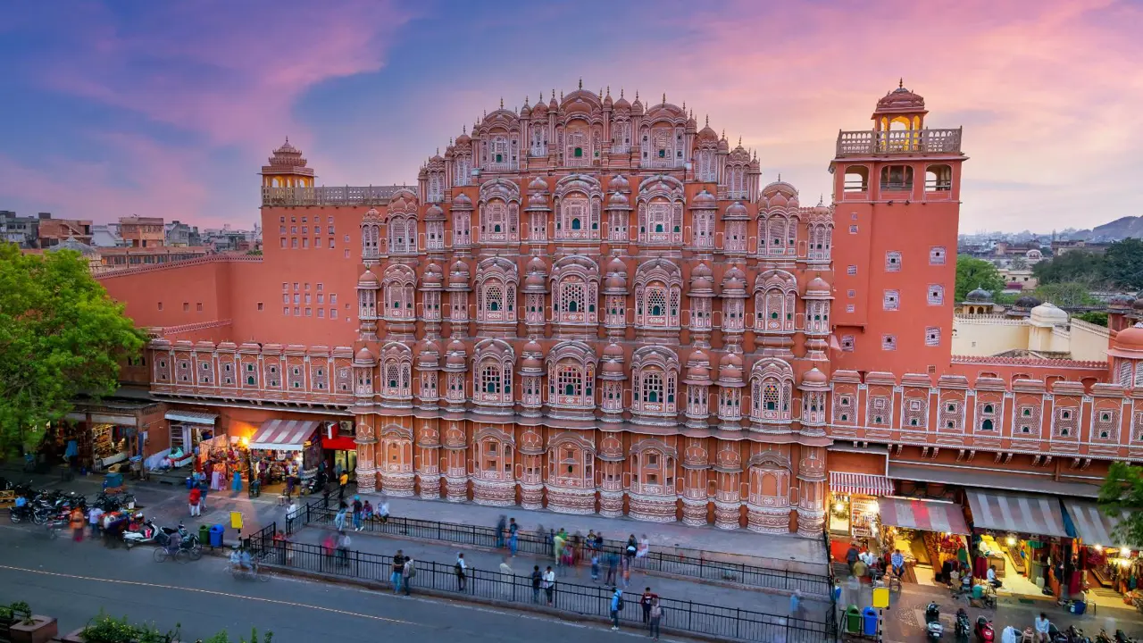 The Hawa Mahal, or Palace of the Winds, in Jaipur’s Pink City, displaying its striking honeycomb façade with hundreds of intricately carved windows at sunset