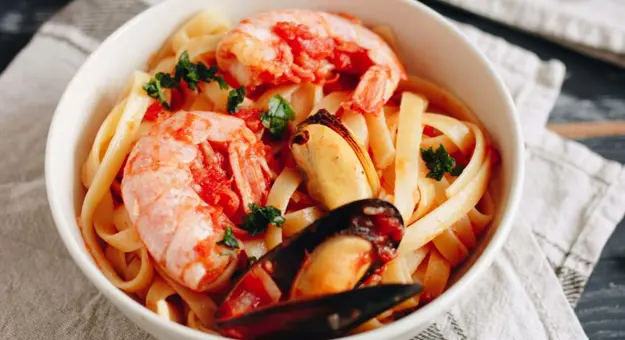 Close up of a bowl of seafood linguine