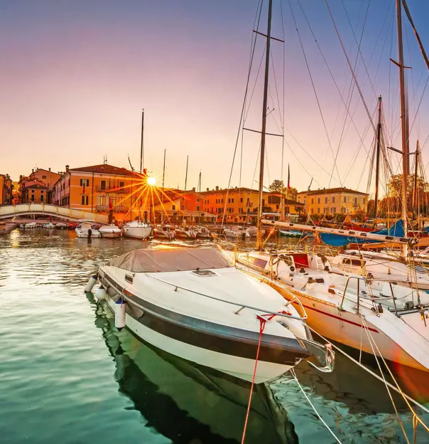 Bardolino Harbour, Lake Garda, Italy, with boats on the water 