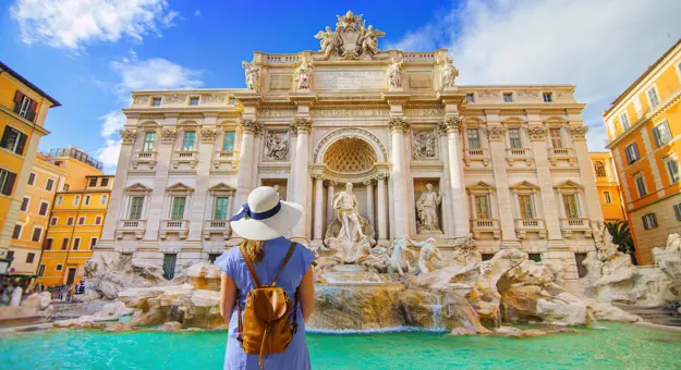 Back of woman in front of Trevi Fountain