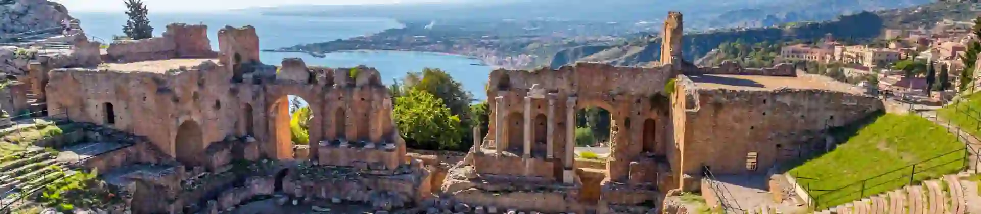 View of Taormina with Theatre of Taormina and Mount Etna, Sicily, Italy
