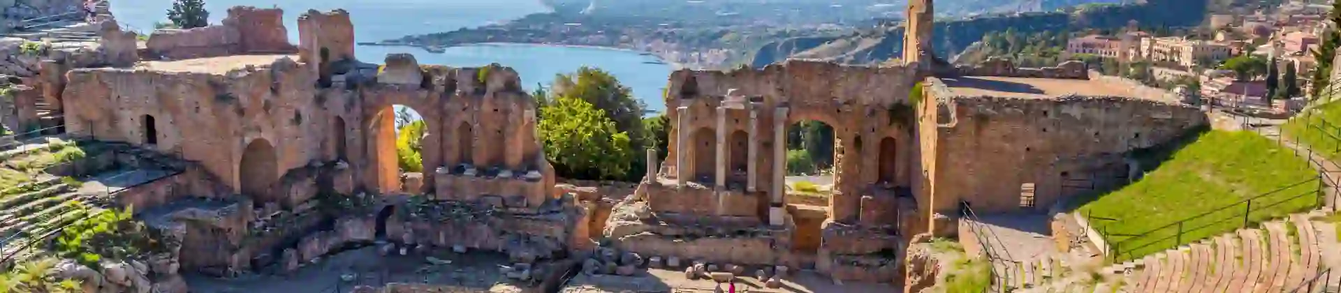 View of Taormina with Theatre of Taormina and Mount Etna, Sicily, Italy