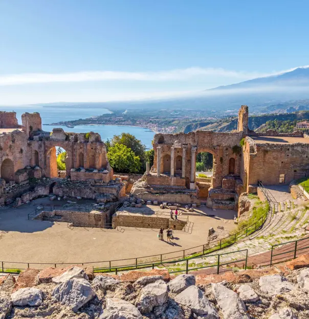 View of Taormina with Theatre of Taormina and Mount Etna, Sicily, Italy