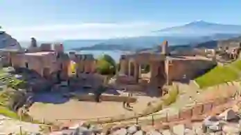 View of Taormina with Theatre of Taormina and Mount Etna, Sicily, Italy
