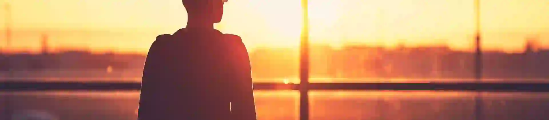 Person walking to departure gate in an airport