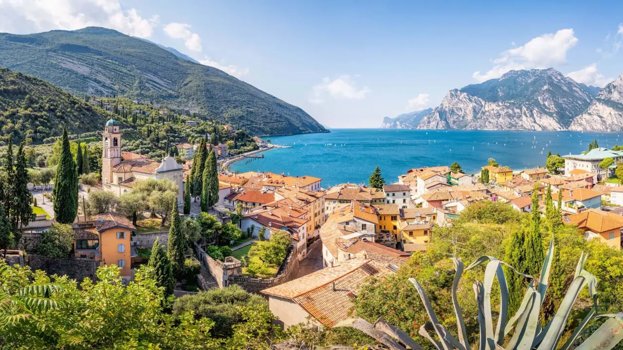 View of water from Torbole, Lake Garda with buildings in forefront