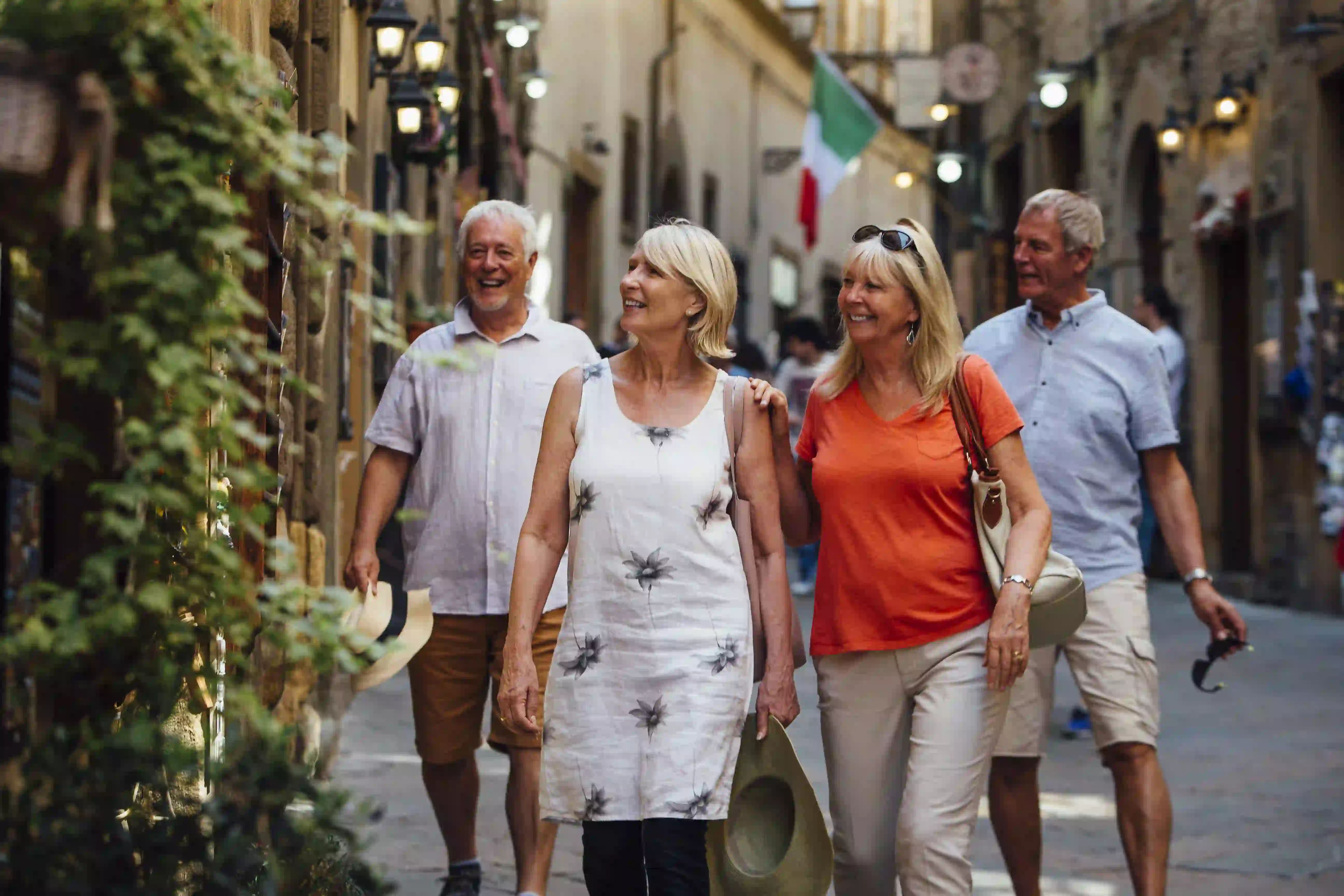 four people walking through the streets in Europe on holiday