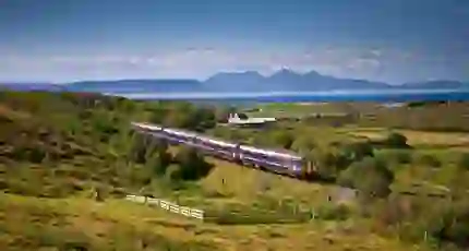A Sprinter Mallaig Line train going along the railway in the Scottish Highlands