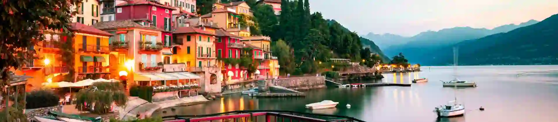 Buildings of Lake Como and the body of water at sunset
