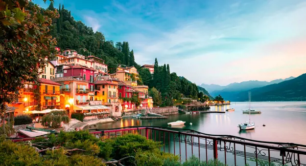 Buildings of Lake Como and the body of water at sunset