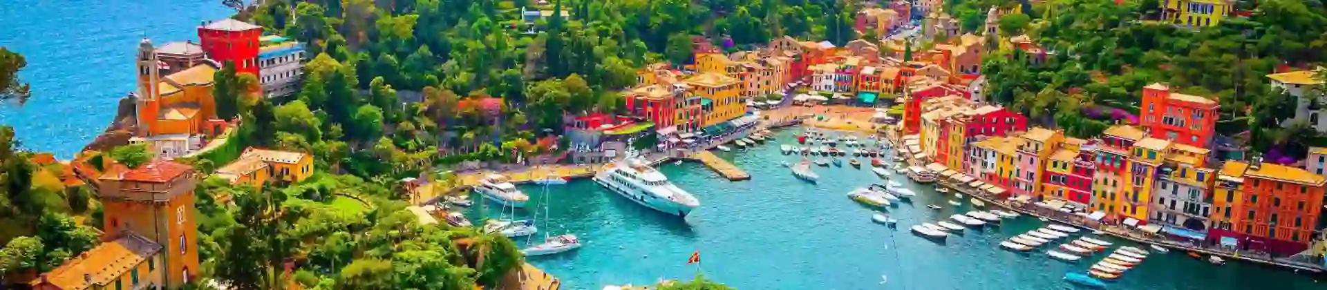 High-angle shot of colourful buildings alongside a marina in Portofino in Italy