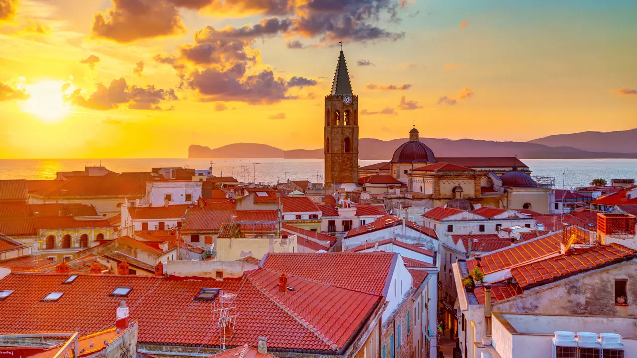 View of Alghero with the sea in the background at sunset