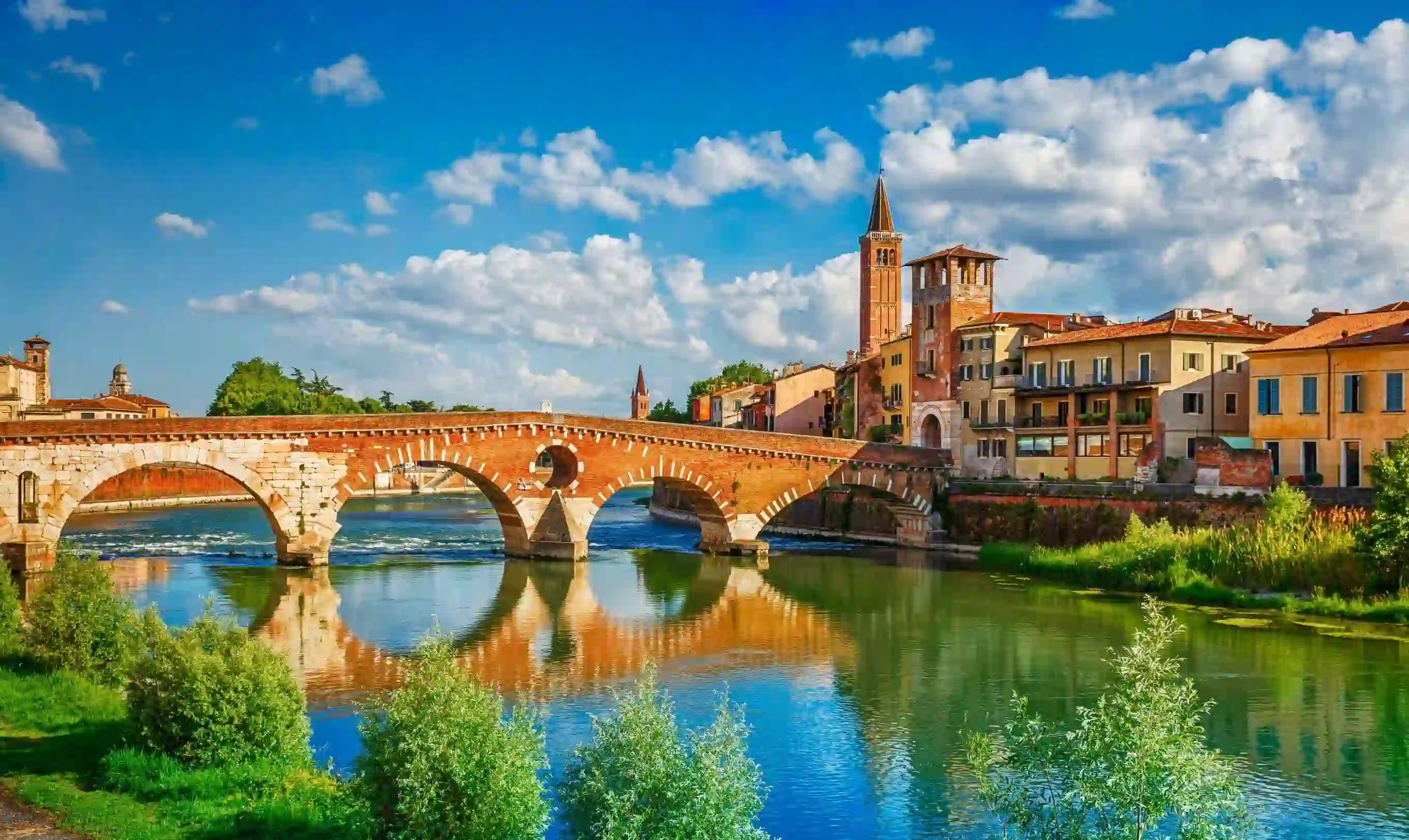 Ponte Pietra bridge and Verona's waterfront buildings