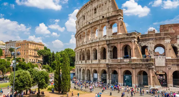 Shot of half the Colosseum and half some of the town in Rome