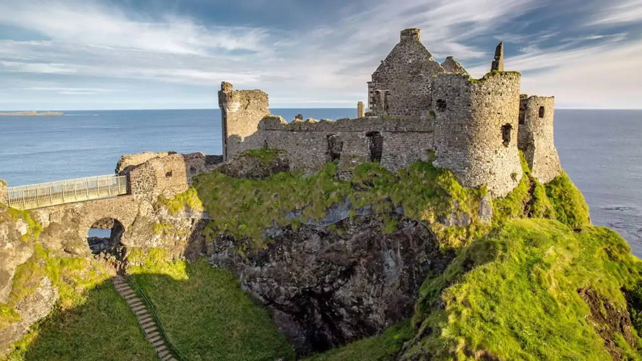 High angle view of a castle on a hill, looking over the sea