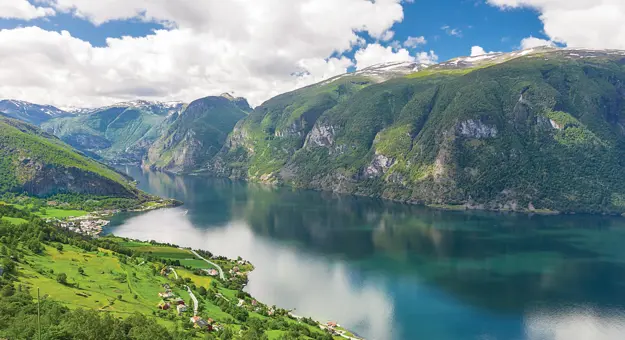 Fjord in Norway surrounded by mountains 