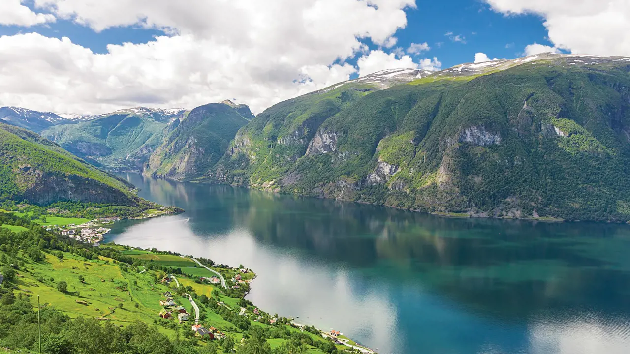 Fjord in Norway surrounded by mountains 