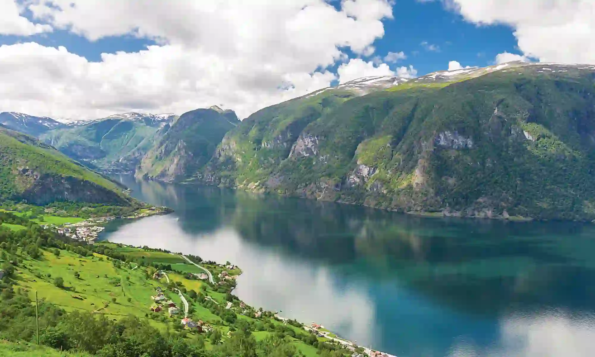 Fjord in Norway surrounded by mountains 