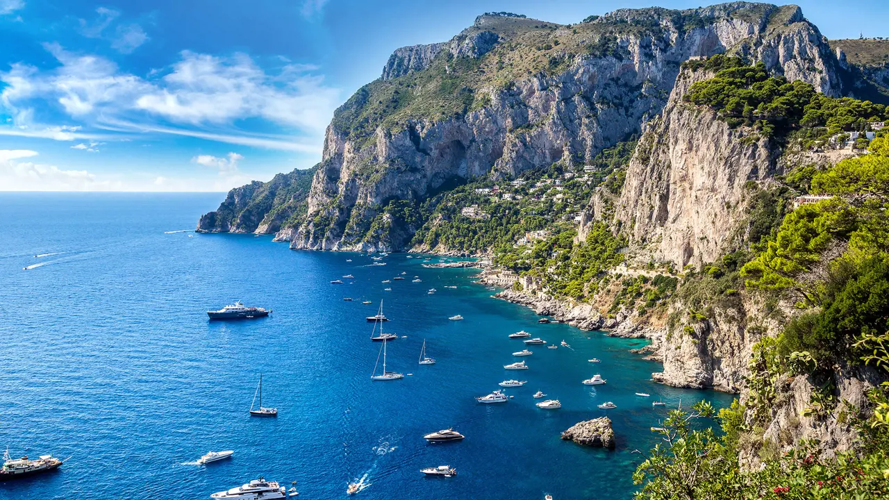 Bay of Capri with cliffs and boats