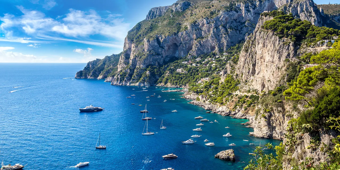 Bay of Capri with cliffs and boats