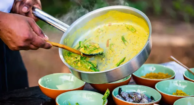 Chef preparing traditional Sri Lankan curry