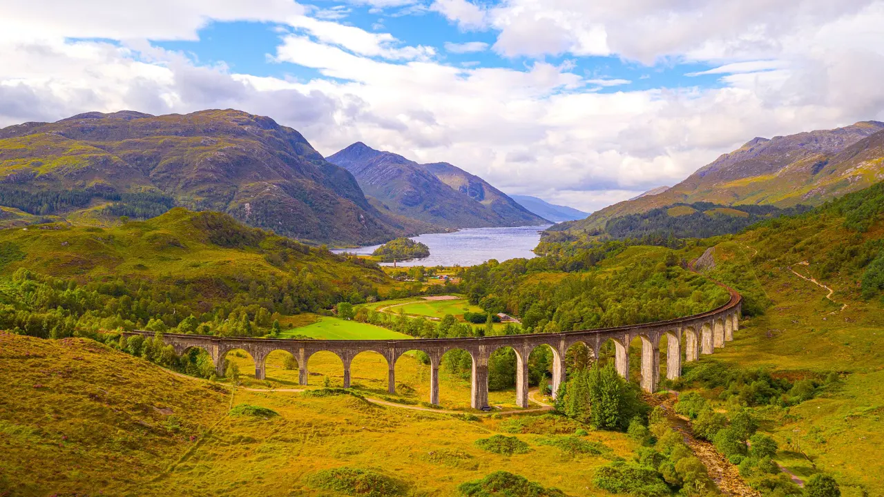 View of Glenfinnan Viaduct and its surrounding mountains 