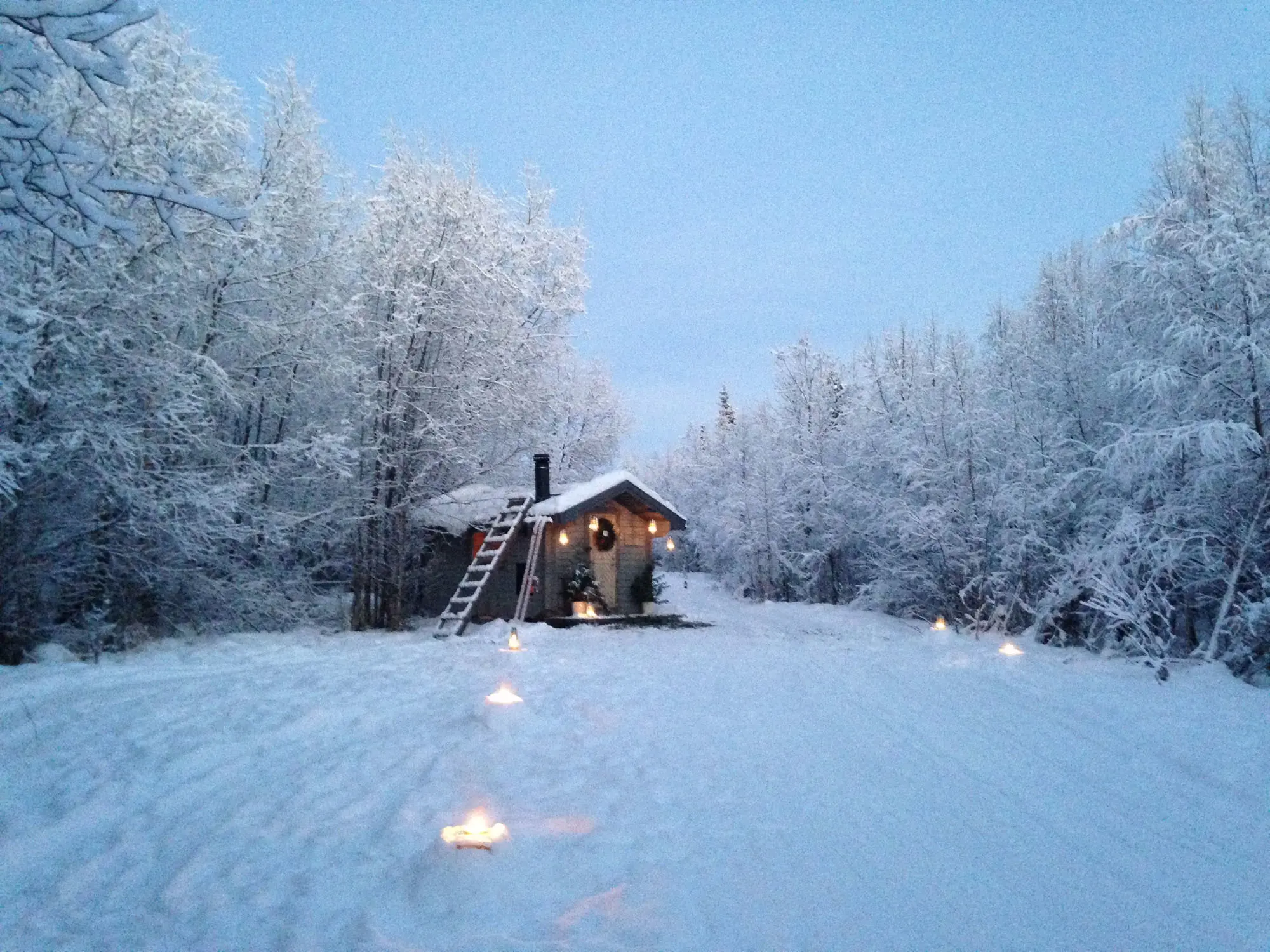 A cabin in the snowy woods in Pajala, Lapland