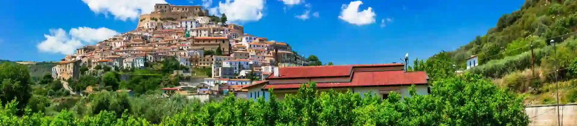View of Rocca Imperiale in Cosenza Province, Southern Italy, showing the houses that cover the mountain and the castle at the top
