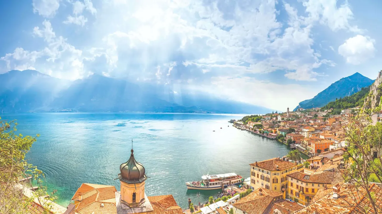 View of water from Limone, Lake Garda with buildings and boat in the forefront