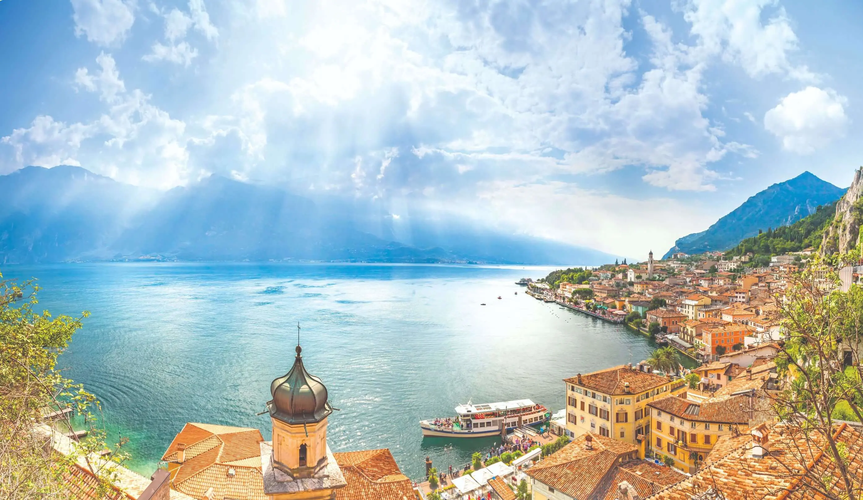 View of water from Limone, Lake Garda with buildings and boat in the forefront