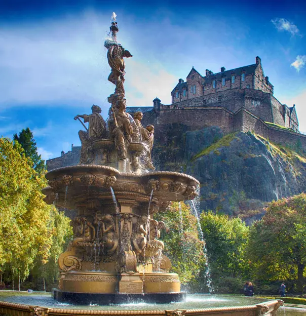 Shot of Edinburgh Castle on the top of the hill and Ross fountain in the forefront