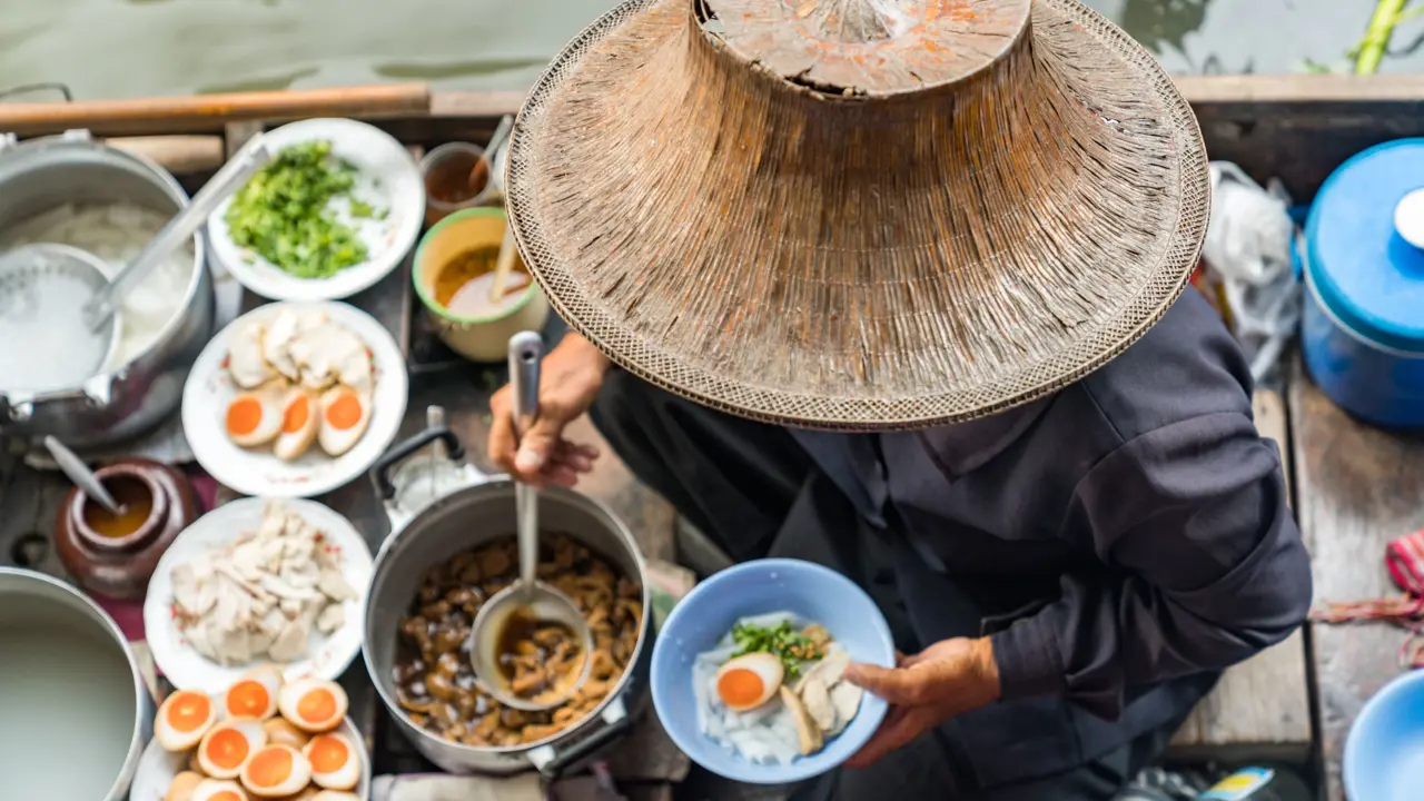 Image of person preparing Thai Food on Floating Market