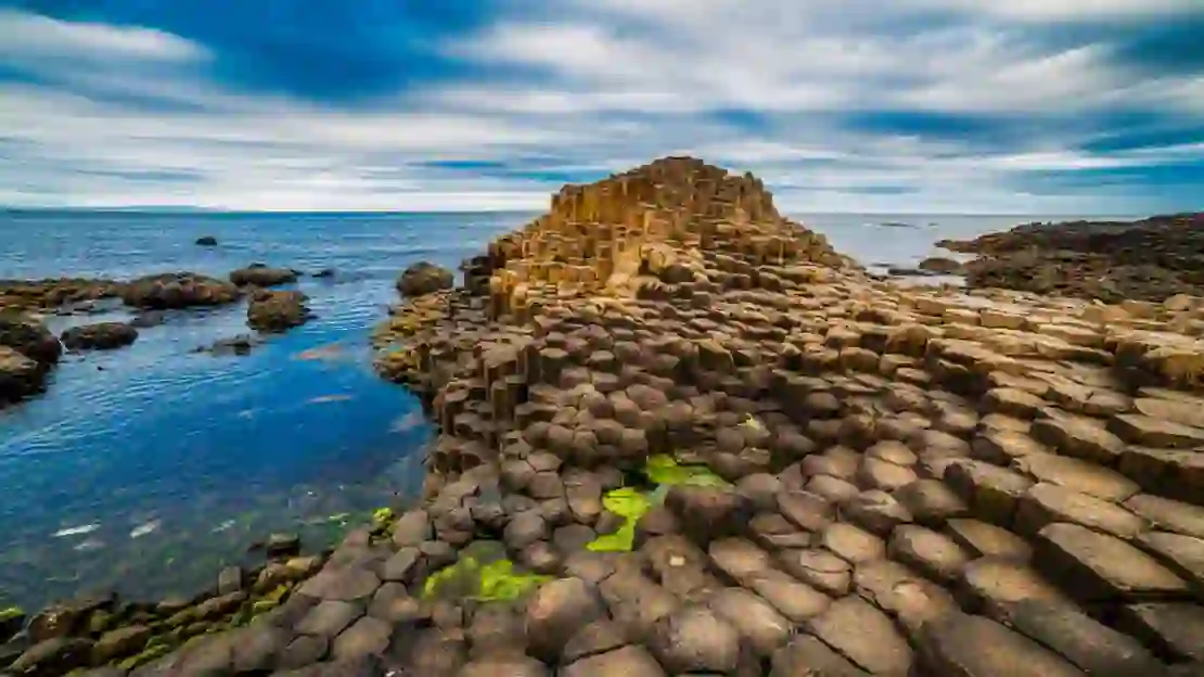 Giant's Causeway bumpy rock formation, with the view of the sea