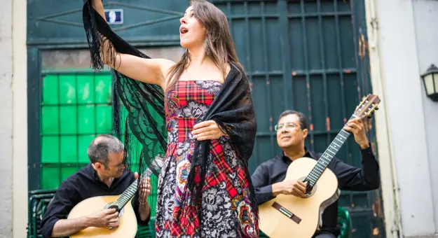 Fado Band Performing Traditional Portuguese Music On The Square Of Alfama, Lisbon, Portugal