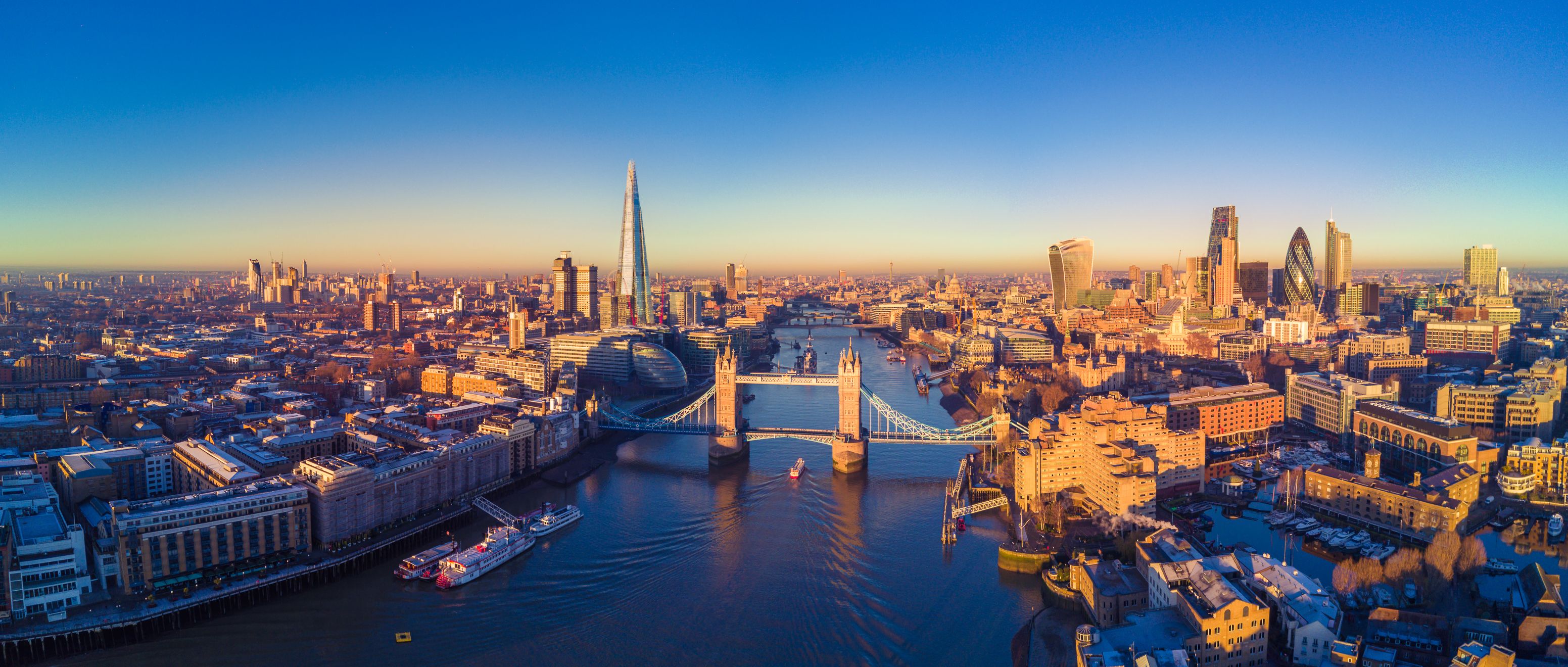 View of the London skyline at sunrise, showing the city's skyscrapers