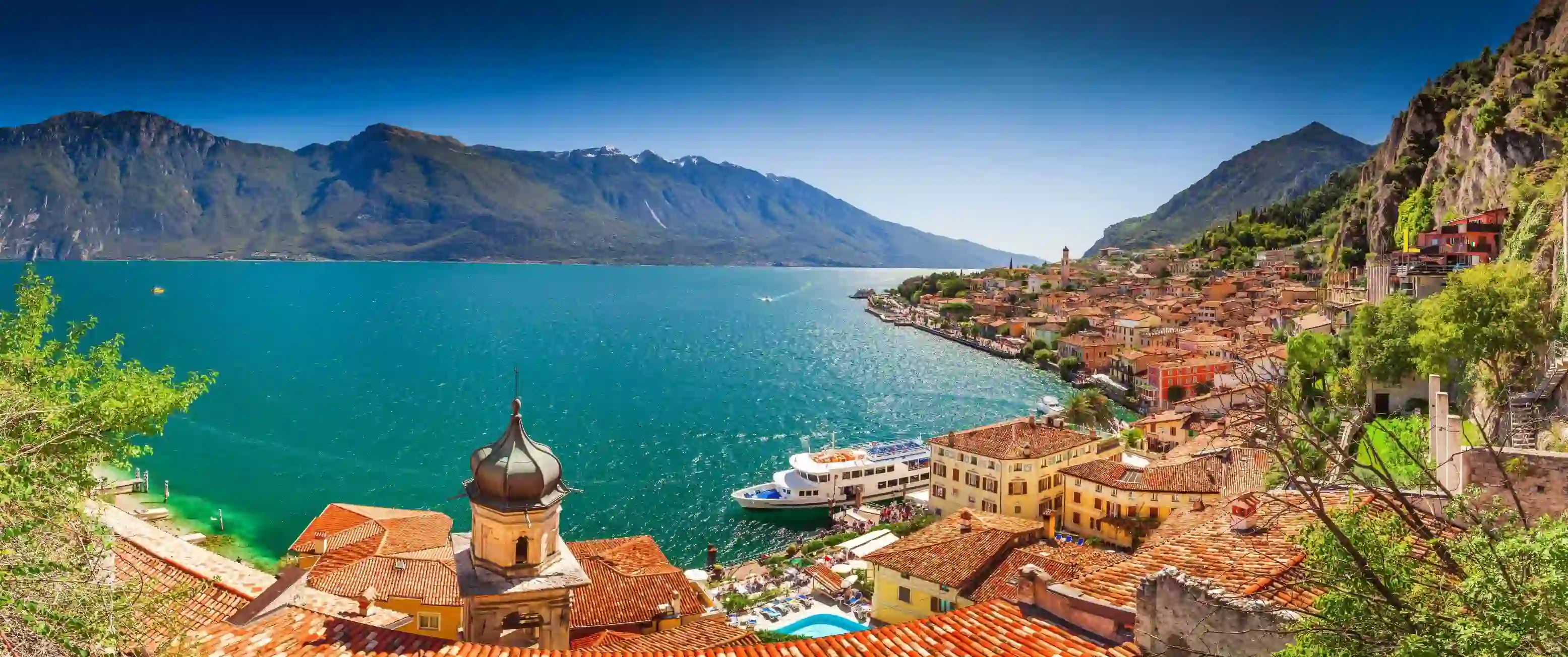 Bay of Limone Lake Garda, showing builidngs and a boat