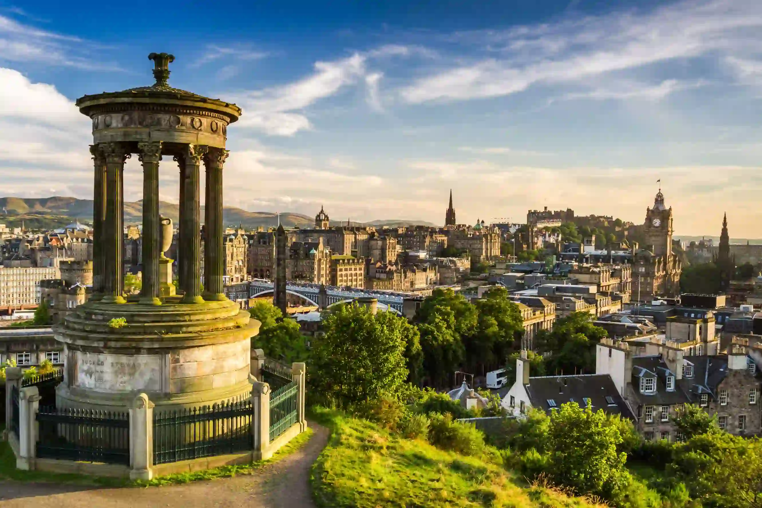 View of Edinburgh city, with the Dugald Stewart Monument in the left forefront