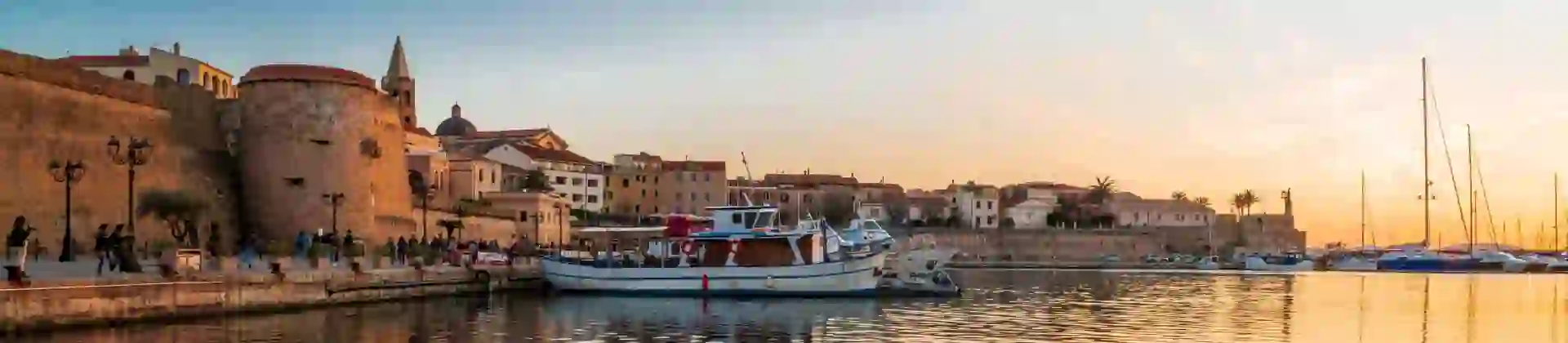 View of Magellano Bastion harbour at sunset, Alghero, Sardinia