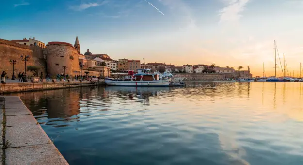 View of Magellano Bastion harbour at sunset, Alghero, Sardinia