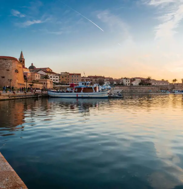 View of Magellano Bastion harbour at sunset, Alghero, Sardinia